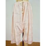 A pair of early 20th Century Zoroastrian Parsi ijars of pink figured silk, having a gara border