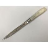 An Edwardian silver letter opener, having carved mother of pearl grip scales and an engraved