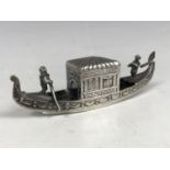 A white metal model of a gondola, having indistinct marks to the base, tests as silver, 44.5g