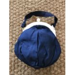 A 1930s evening bag with ivory cantle and spherical button, having a navy-blue faille pouch with a