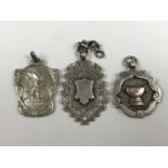 Two early 20th Century silver watch chain fob medallions, together with an Art Nouveau