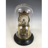 A late 19th Century torsion clock by Gustav Becker, 26 cm excluding glass dome