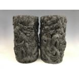 A pair of Meiji Japanese large bronze "dragon" vases, each finely hollow-cast as dragons writhing in