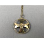 A high-carat yellow-metal Maltese cross pendant necklace, of domed planar form suspended within an