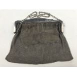 A George V silver mesh evening purse, with shaped cantle and leather coin pocket, Frank William