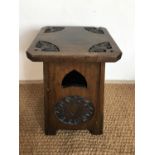 A late 19th / early 20th Century Arts and Crafts carved walnut stool, 51 cm high