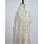 An early 20th Century Tulle-bi-telli or 'Assuit' silver shawl, of fine bobbinet, hand woven with