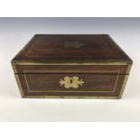 A George IV brass mounted rosewood stationary box, having a pair of campaign-style inset brass