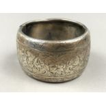 A Victorian silver hinged bracelet, the face engraved with bands of flowers and foliage, Birmingham,