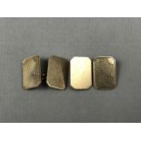 A gentleman's pair of 9ct gold cuff links, of rectangular form with canted corners, having