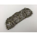 A Victorian silver menu holder, cast and reticulated in depiction of the green man flanked by