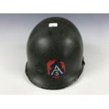 A Second World War US Army M1 steel helmet, bearing 5th Army and rank decals