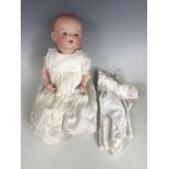 An Armand Marseille 'My Dream' baby doll, the bisque head modelled with open mouth, two lower