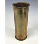 A Great War trench art shell case vase engraved J A S Johnston, 1st Batt KOSB and depicting a