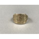 A gentleman's 9ct gold signet ring, having scored decoration to the face and shoulders, 10g