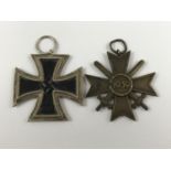 A German Third Reich Iron Cross second class together with a War Merit Cross with swords