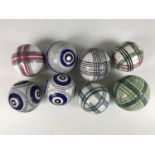 Eight 19th Century Scottish earthenware carpet bowls, hand painted with assorted geometric