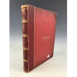 A large early 20th Century leather-bound album of postcards, photographs and ephemera documenting