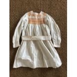 An early 20th Century child's Bohemian influenced cotton dress, having a squared yoke with hand-