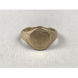 A gentleman's 9ct gold signet ring, the face engraved with a monogram, the interior bearing the