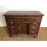 A late 19th / early 20th Century reproduction George III mahogany kneehole desk, 95 cm x 42 cm x