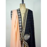 A mid 20th Century Zoroastrian Parsi sari of peach georgette with an applied black satin border