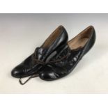 A lady's pair of 1920s Louden black leather lace up shoes, having a scalloped design, sized 7