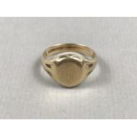 A gentleman's vintage 9ct gold signet ring, having engraved monogram, and engraved dedication to the