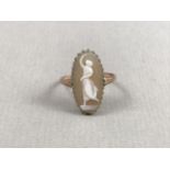 An early 20th Century cameo ring, of lenticular form, carved in depiction of a dancing figure, crown