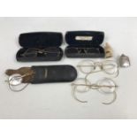Collectors' items including late 19th / early 20th Century reading glasses, a carved bone whistle,