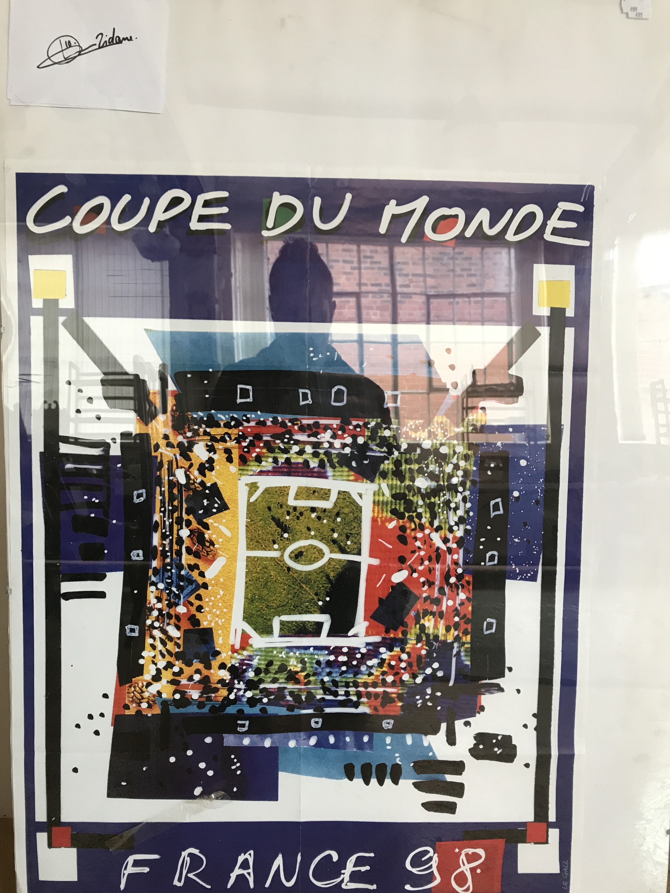 A Zinidine Zidane autograph together with a France 1998 World Cup poster