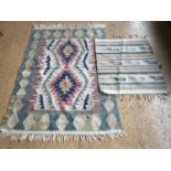 Two Aztec style woven cotton rugs, 112 x 180 cm and 76 x 90 cm