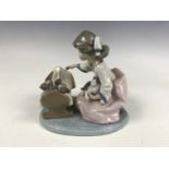 A Lladro figurine of a cradle of kittens 5784