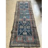 An early 20th Century woven runner / rug, 106 x 330 cm