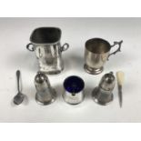 An electroplate christening cup together with an electroplate cruet set and sauce holder etc