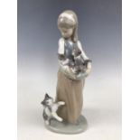 A Lladro figurine of a girl with cats, 1309