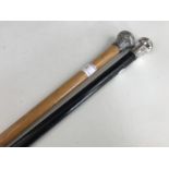 Two antique walking canes with silver pommels