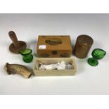 Collectors' items including a treen box depicting Cromer, two eye baths and a treen darning mushroom