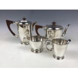 A 1930s Walker and Hall Bakelite mounted electroplate tea and coffee set