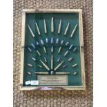 A framed display of inert rifle cartridges and bullets entitled 'Bullets of the World muzzle and