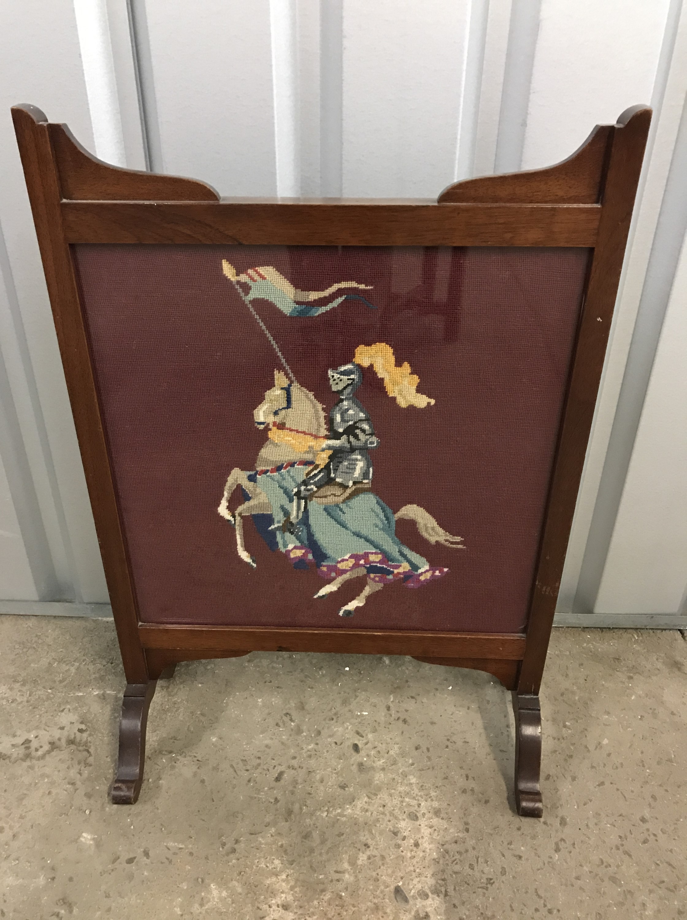 A mahogany framed tapestry fire screen embroidered with St George