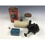 A stoneware hot water bottle together with vintage tins, a Beech-Nut jar and a grinder