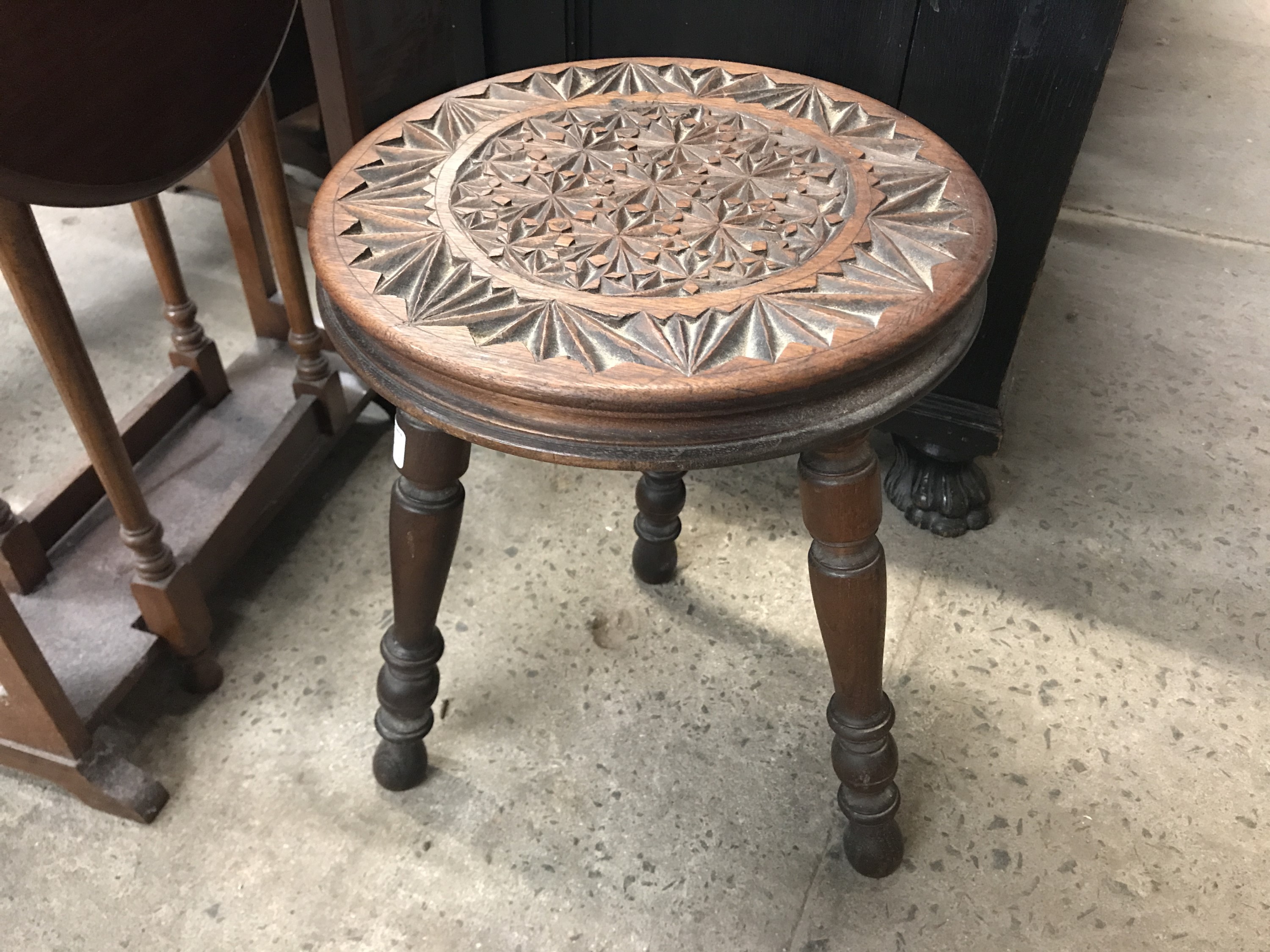 A Victorian chip-carved stool