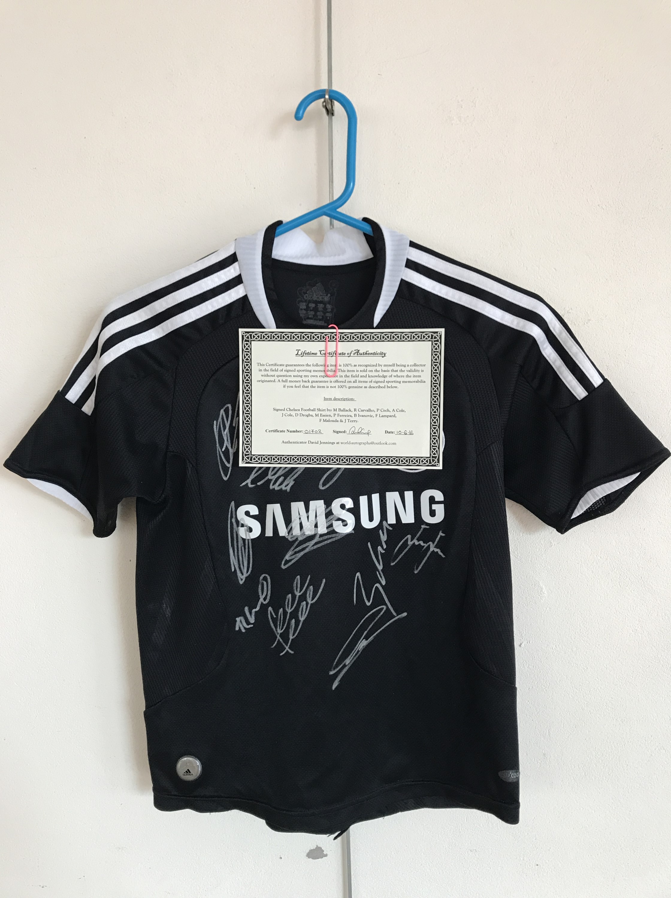 A signed Chelsea Football shirt, bearing the signatures of M Ballack, R Carvalho, P Cech, A Cole,