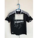 A signed Chelsea Football shirt, bearing the signatures of M Ballack, R Carvalho, P Cech, A Cole,