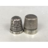 A Charles Horner silver Dorcas thimble, together with one other Charles Horner silver thimble, 11.