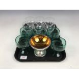 Five late 19th / early 20th century free-blown emerald glass goblets together with six further