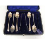 A cased set of George V silver Old English pattern teaspoons and sugar tongs, W. S. Savage & Co,