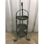 An early 20th Century Arts and Crafts wrought iron and copper cake stand