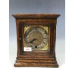 An oak mantel clock with quartz movement